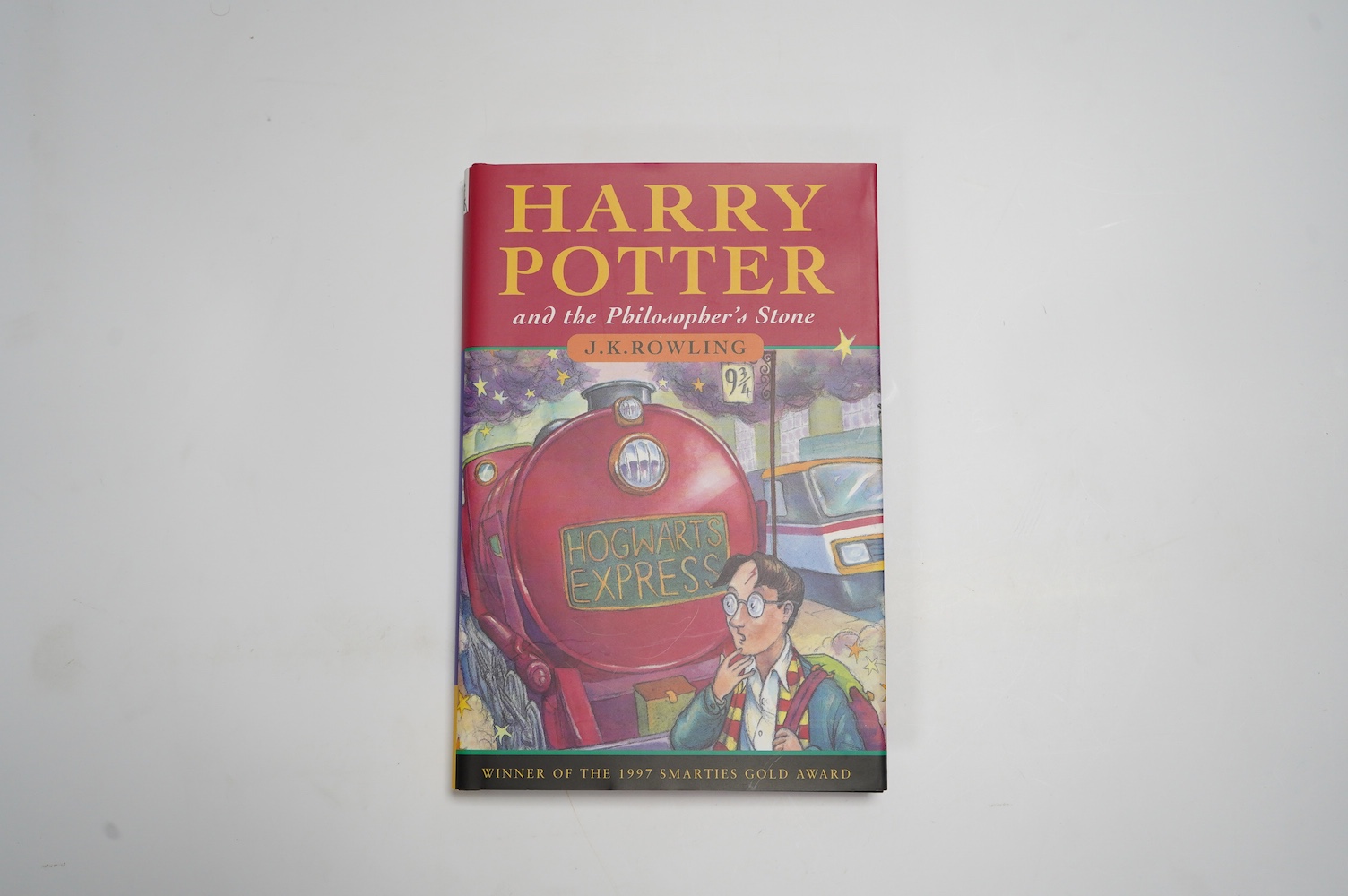 Rowling, J. K. - Harry Potter and the Philosopher's Stone. First Edition (reprinted). armorial half and title pages. publisher's coloured pictorial boards and d/wrapper. Bloomsbury, (?1999)